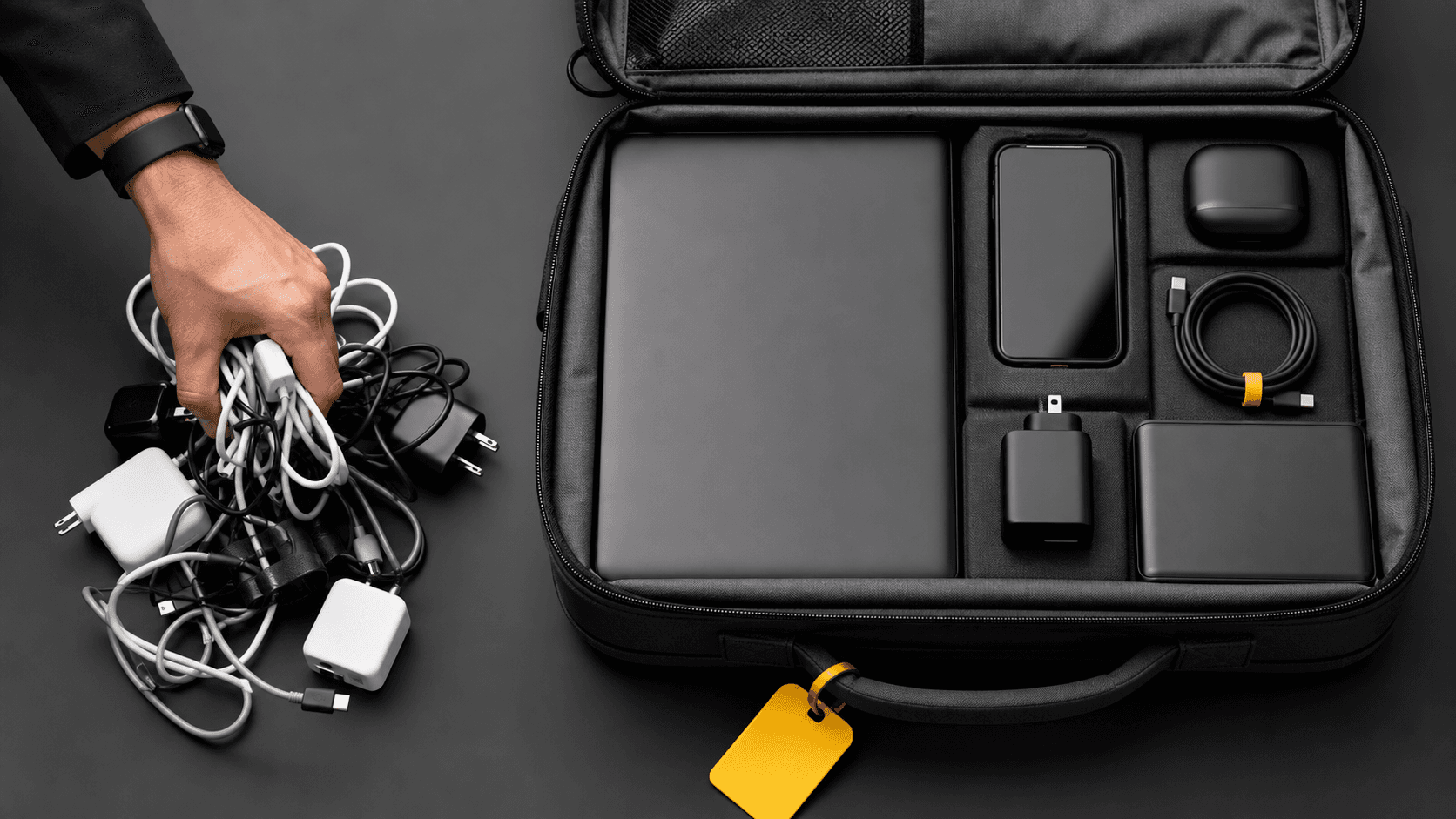 Open suitcase on a bed with tangled phone chargers and cables spilling out, lit by warm morning light